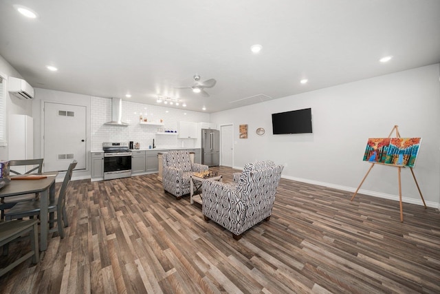 17110 W Boone Ln, Medical Lake, WA 99022 - living room with ceiling fan, dark wood-style flooring, a wall mounted AC, recessed lighting, and baseboards