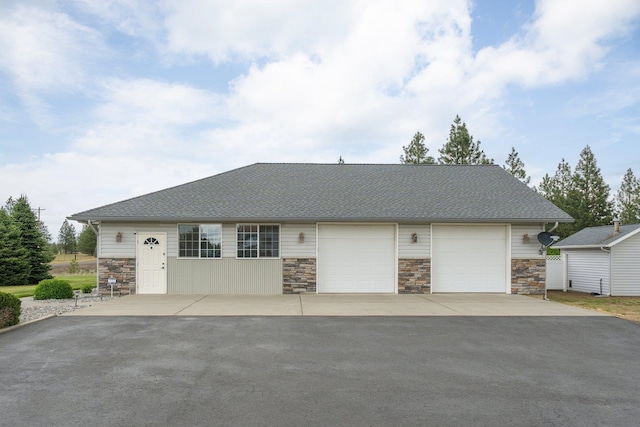 17110 W Boone Ln, Medical Lake, WA 99022 - view of front of property with stone siding, asphalt driveway, and an attached garage