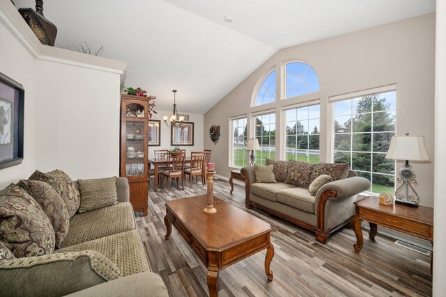 17110 W Boone Ln, Medical Lake, WA 99022 - living area with a chandelier, light wood-type flooring, and high vaulted ceiling