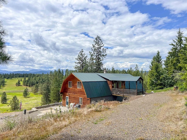 2010 Clemons Rd, Rice, WA 99167 - view of front of property with a gambrel roof, metal roof, a chimney, and a barn
