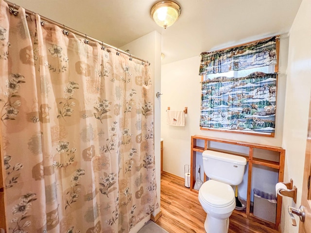 2010 Clemons Rd, Rice, WA 99167 - bathroom with wood finished floors, toilet, and curtained shower