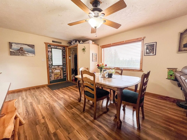 2010 Clemons Rd, Rice, WA 99167 - dining space with wood finished floors, baseboards, a ceiling fan, and a textured ceiling