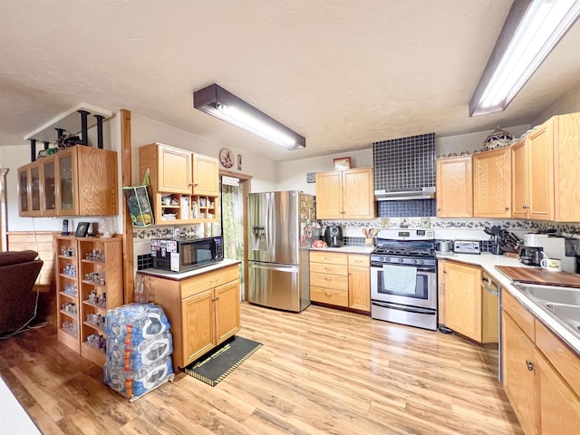 2010 Clemons Rd, Rice, WA 99167 - kitchen with stainless steel appliances, light wood finished floors, and light countertops