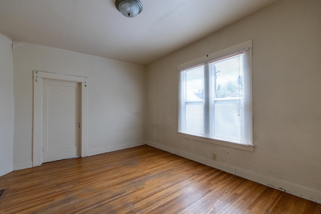608 S Hatch St, Spokane, WA 99202 - spare room featuring plenty of natural light, wood finished floors, and baseboards