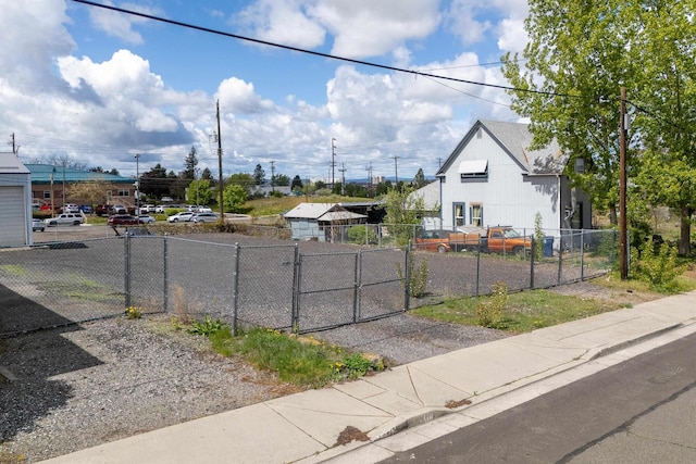 608 S Hatch St, Spokane, WA 99202 - view of side of home featuring a gate and uncovered parking
