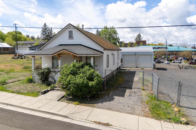 608 S Hatch St, Spokane, WA 99202 - bungalow-style home with a gate, a shingled roof, a garage, and an outdoor structure