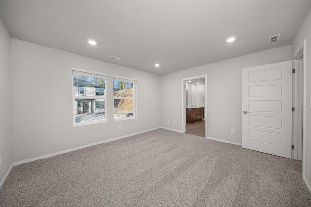 3716 S Keller Ln, Spokane Valley, WA 99206 - unfurnished bedroom with carpet floors, baseboards, recessed lighting, and ensuite bath