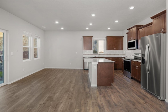 3716 S Keller Ln, Spokane Valley, WA 99206 - kitchen featuring appliances with stainless steel finishes, a sink, a center island, recessed lighting, and dark wood-style floors