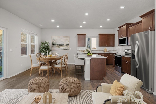 3716 S Keller Ln, Spokane Valley, WA 99206 - kitchen with stainless steel appliances, a center island, recessed lighting, light countertops, and plenty of natural light