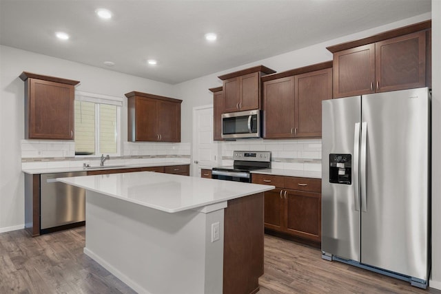 3716 S Keller Ln, Spokane Valley, WA 99206 - kitchen with stainless steel appliances, a sink, tasteful backsplash, dark wood-style floors, and recessed lighting