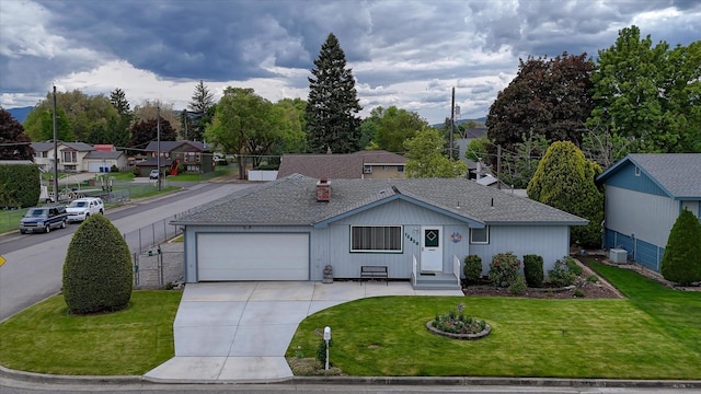 12820 E Sinto Ave, Spokane Valley, WA 99216 - ranch-style home with a garage, driveway, central AC unit, and a residential view