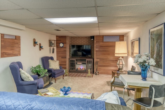 12820 E Sinto Ave, Spokane Valley, WA 99216 - carpeted living area featuring wood walls and a paneled ceiling