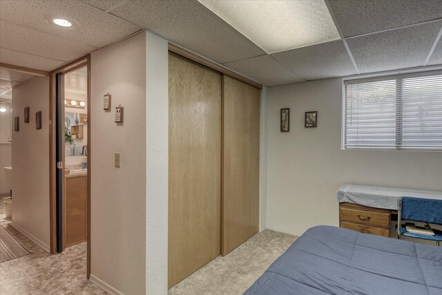 12820 E Sinto Ave, Spokane Valley, WA 99216 - bedroom featuring a drop ceiling, carpet, a closet, and connected bathroom