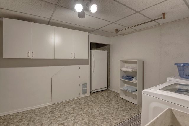 12820 E Sinto Ave, Spokane Valley, WA 99216 - laundry room with washer / clothes dryer, tile patterned floors, and cabinet space