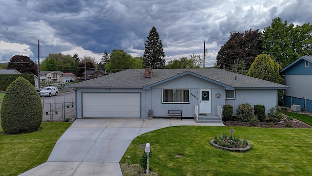 12820 E Sinto Ave, Spokane Valley, WA 99216 - single story home with concrete driveway, an attached garage, a chimney, and roof with shingles