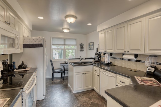 12820 E Sinto Ave, Spokane Valley, WA 99216 - kitchen featuring white appliances, a sink, a peninsula, dark countertops, and recessed lighting