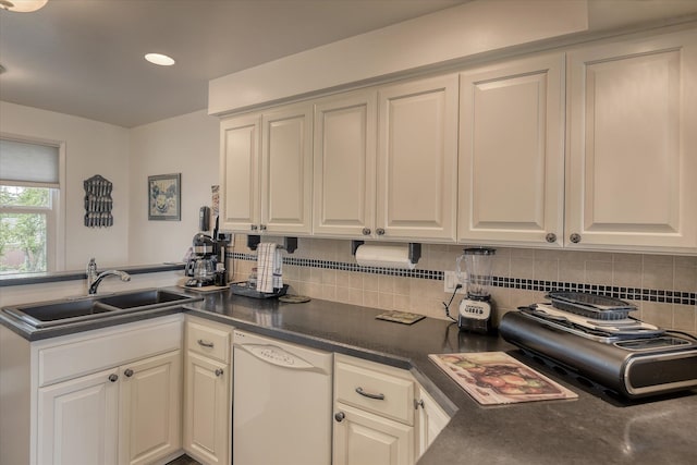 12820 E Sinto Ave, Spokane Valley, WA 99216 - kitchen with dishwasher, a sink, decorative backsplash, dark countertops, and white cabinetry