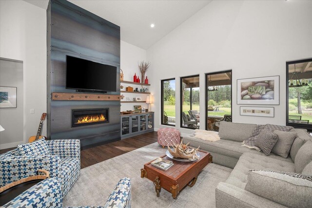 220 E Meadowlane Rd, Spokane, WA 99224 - living area featuring high vaulted ceiling, a glass covered fireplace, wood finished floors, baseboards, and recessed lighting