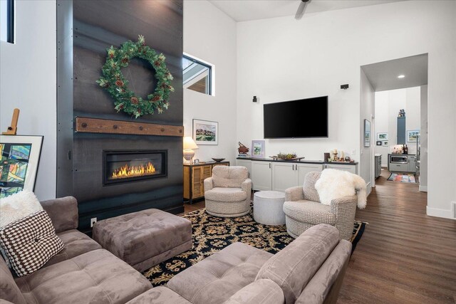220 E Meadowlane Rd, Spokane, WA 99224 - living area with wood finished floors, a glass covered fireplace, a high ceiling, and baseboards