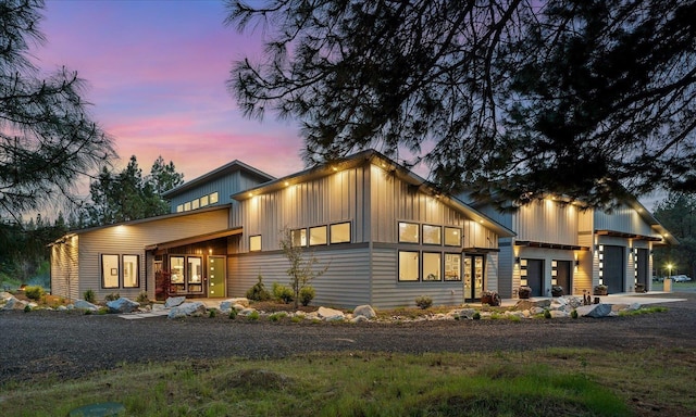 220 E Meadowlane Rd, Spokane, WA 99224 - modern home featuring board and batten siding, dirt driveway, and an attached garage
