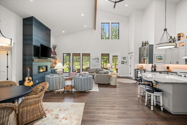 220 E Meadowlane Rd, Spokane, WA 99224 - living area featuring high vaulted ceiling, a glass covered fireplace, dark wood-style floors, and recessed lighting