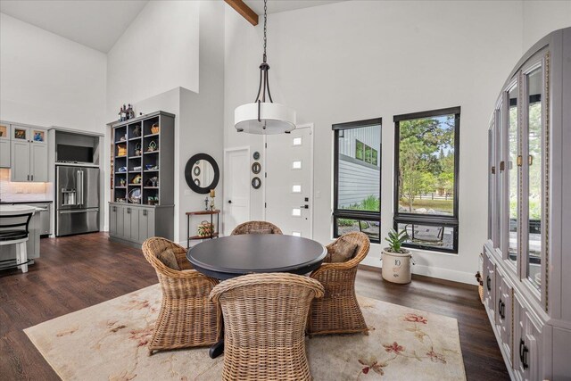 220 E Meadowlane Rd, Spokane, WA 99224 - dining space featuring high vaulted ceiling, dark wood-style floors, and baseboards