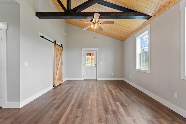 344 W Deer Park Milan Rd, Deer Park, WA 99006 - unfurnished living room with a barn door, wood ceiling with exposed beams, healthy amount of natural light, wood finished floors, and ceiling fan