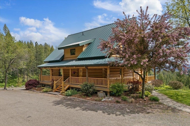 18109 N Harvard Ln, Newman Lake, WA 99025 - log cabin featuring a porch, metal roof, and log exterior