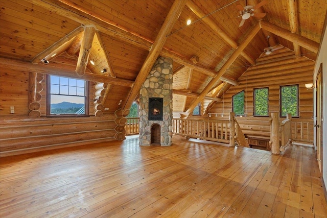 18109 N Harvard Ln, Newman Lake, WA 99025 - bonus room with rustic walls, wood ceiling with exposed beams, wood-type flooring, healthy amount of natural light, and a ceiling fan