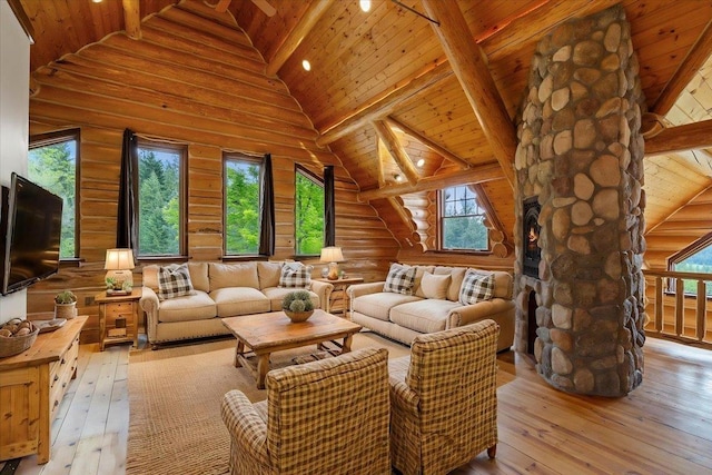 18109 N Harvard Ln, Newman Lake, WA 99025 - living room with wood ceiling with exposed beams, high vaulted ceiling, light wood finished floors, and log walls