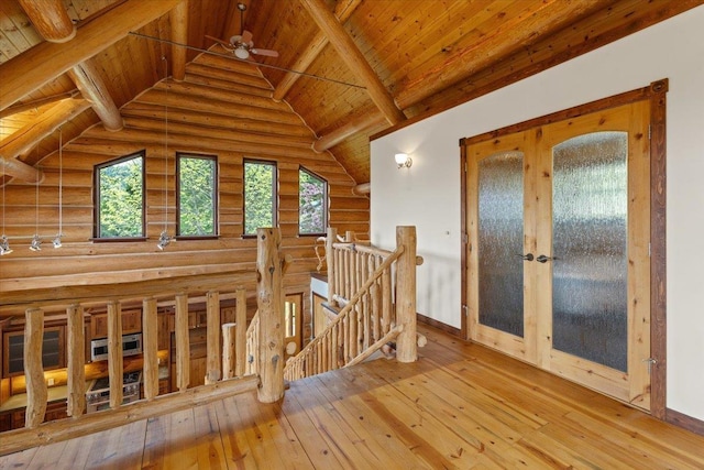 18109 N Harvard Ln, Newman Lake, WA 99025 - corridor with an upstairs landing, healthy amount of natural light, log walls, hardwood / wood-style floors, and baseboards