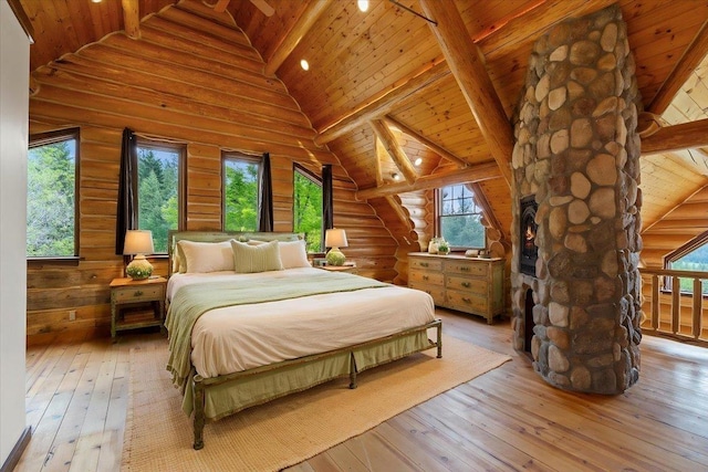 18109 N Harvard Ln, Newman Lake, WA 99025 - bedroom with wooden ceiling with exposed beams, multiple windows, hardwood / wood-style floors, high vaulted ceiling, and rustic walls