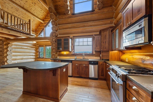 18109 N Harvard Ln, Newman Lake, WA 99025 - kitchen with stainless steel appliances, log walls, a sink, wooden ceiling with exposed beams, and light wood-type flooring