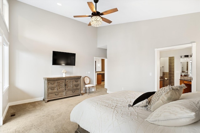 3515 W Excell Ln, Spokane, WA 99208 - bedroom with carpet floors, high vaulted ceiling, baseboards, ensuite bathroom, and a ceiling fan