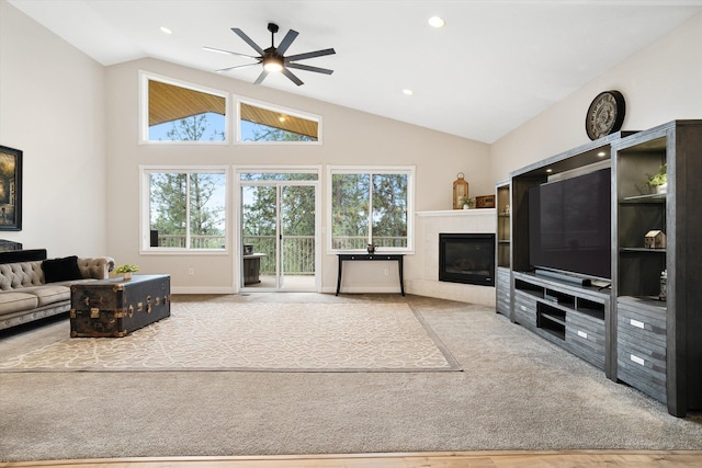 3515 W Excell Ln, Spokane, WA 99208 - living room featuring a glass covered fireplace, a ceiling fan, high vaulted ceiling, recessed lighting, and baseboards