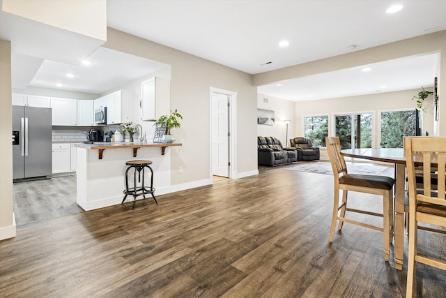 3515 W Excell Ln, Spokane, WA 99208 - dining area featuring wood finished floors, recessed lighting, and baseboards