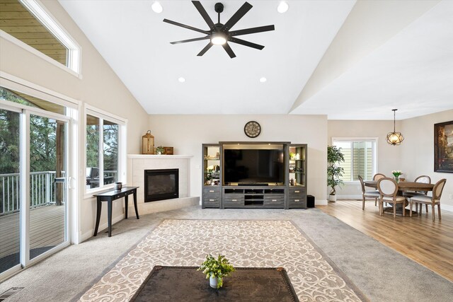 3515 W Excell Ln, Spokane, WA 99208 - living room with ceiling fan, high vaulted ceiling, baseboards, a glass covered fireplace, and recessed lighting