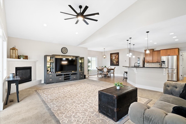 3515 W Excell Ln, Spokane, WA 99208 - living area with a ceiling fan, a glass covered fireplace, baseboards, recessed lighting, and light carpet