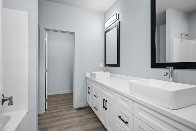 11911 N Main St, Mead, WA 99021 - full bathroom with double vanity, wood finished floors, and baseboards