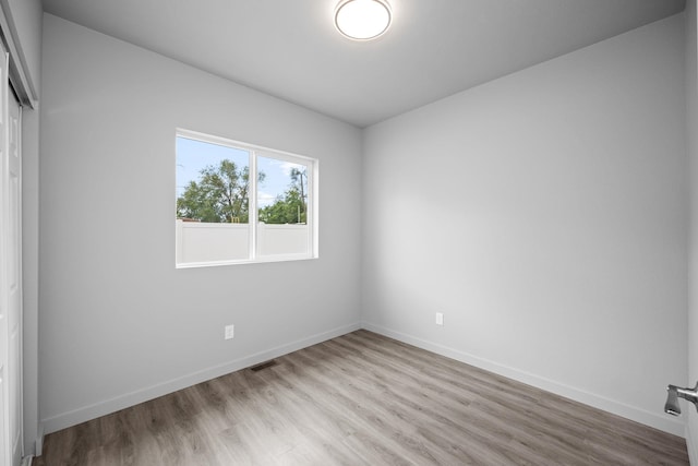 11911 N Main St, Mead, WA 99021 - empty room with light wood-type flooring and baseboards