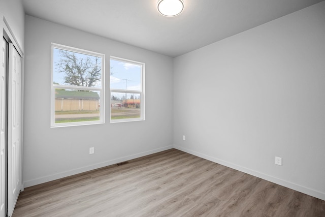 11911 N Main St, Mead, WA 99021 - unfurnished bedroom with light wood-style flooring, baseboards, and a closet
