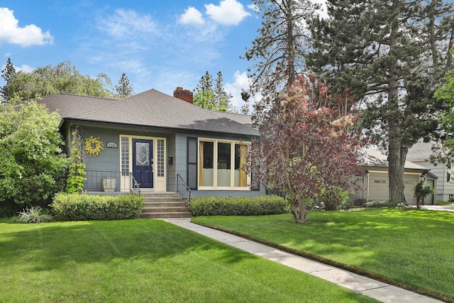 1224 E Thurston Ave, Spokane, WA 99203 - view of front of property with a front lawn, a chimney, and roof with shingles