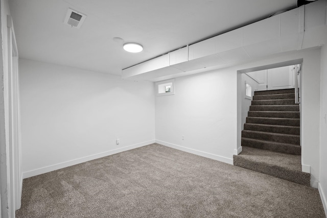 5727 N Cannon St, Spokane, WA 99205 - below grade area featuring carpet, baseboards, and stairway
