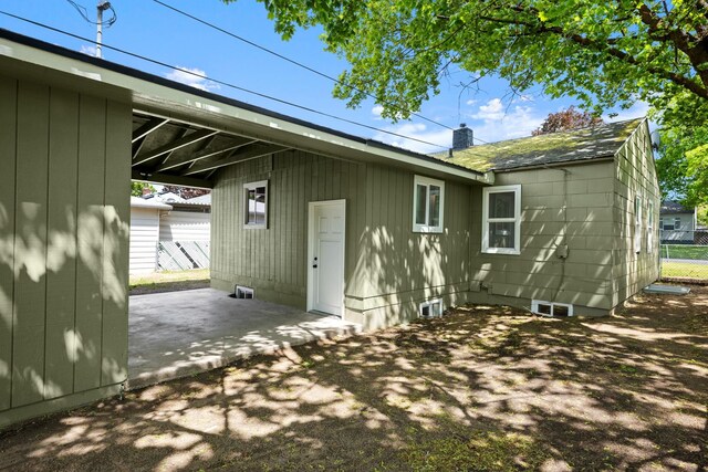 5727 N Cannon St, Spokane, WA 99205 - rear view of property featuring a patio and a chimney