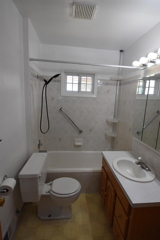 1103 E Longfellow Ave, Spokane, WA 99207 - full bathroom with toilet, tiled shower / bath, healthy amount of natural light, and vanity