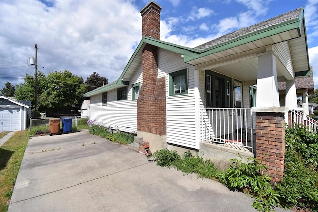 1103 E Longfellow Ave, Spokane, WA 99207 - view of property exterior with a chimney and driveway
