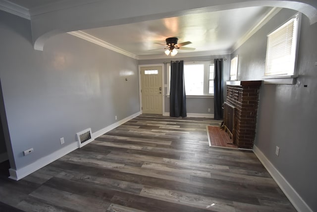 1103 E Longfellow Ave, Spokane, WA 99207 - unfurnished living room with ornamental molding, arched walkways, a ceiling fan, dark wood-style floors, and baseboards