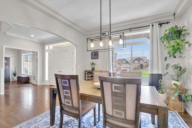 17321 E Morningside Ln, Spokane Valley, WA 99016 - dining room featuring arched walkways, wood finished floors, crown molding, baseboards, and recessed lighting
