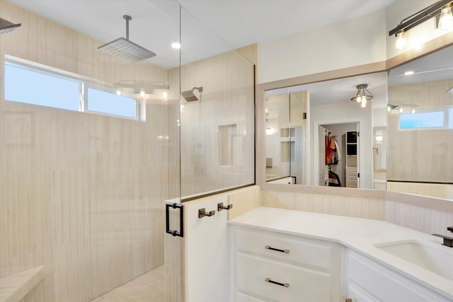 17321 E Morningside Ln, Spokane Valley, WA 99016 - bathroom featuring a stall shower, a walk in closet, and vanity