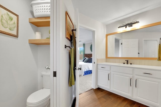 17321 E Morningside Ln, Spokane Valley, WA 99016 - bathroom with wood finished floors, vanity, toilet, and ensuite bath